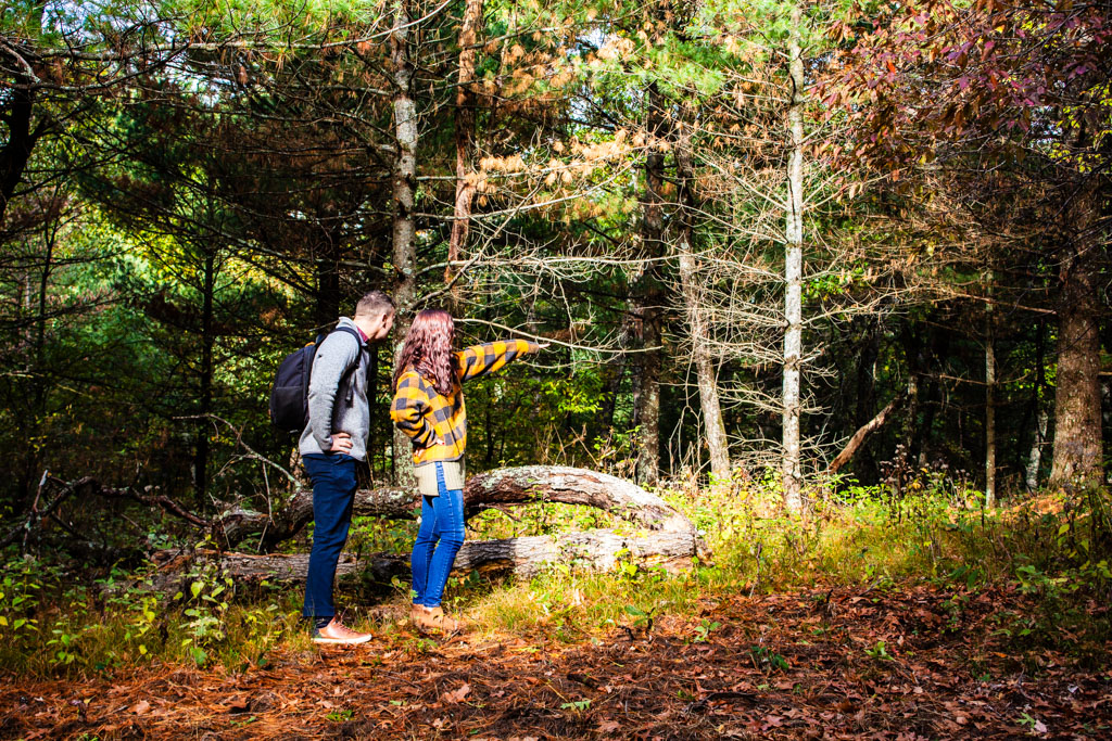 two people in the woods in fall