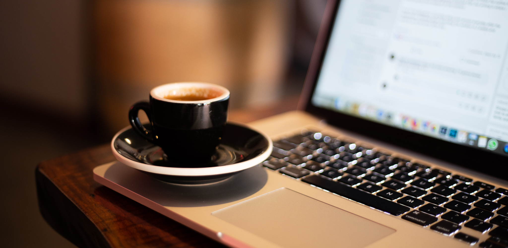 Coffee cup on Laptop